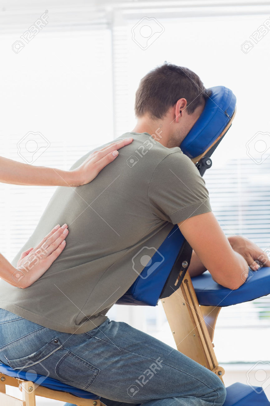 http://www.blissfountain.com/wp-content/uploads/2015/05/27112182-cropped-image-of-therapist-giving-back-massage-to-man-on-massage-chair-in-hospital.jpg